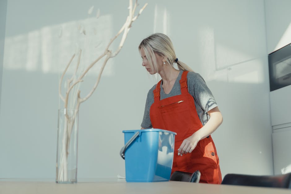 Smiling professional house cleaner